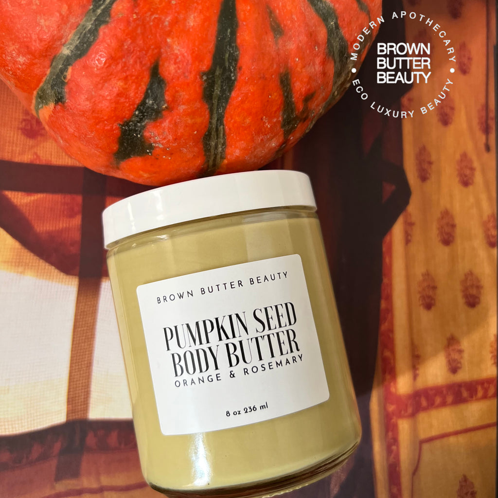 Artisan pumpkin seed butter in a glass jar, highlighting its creamy texture and rich color, ideal for nourishing and hydrating dry skin with organic ingredients.