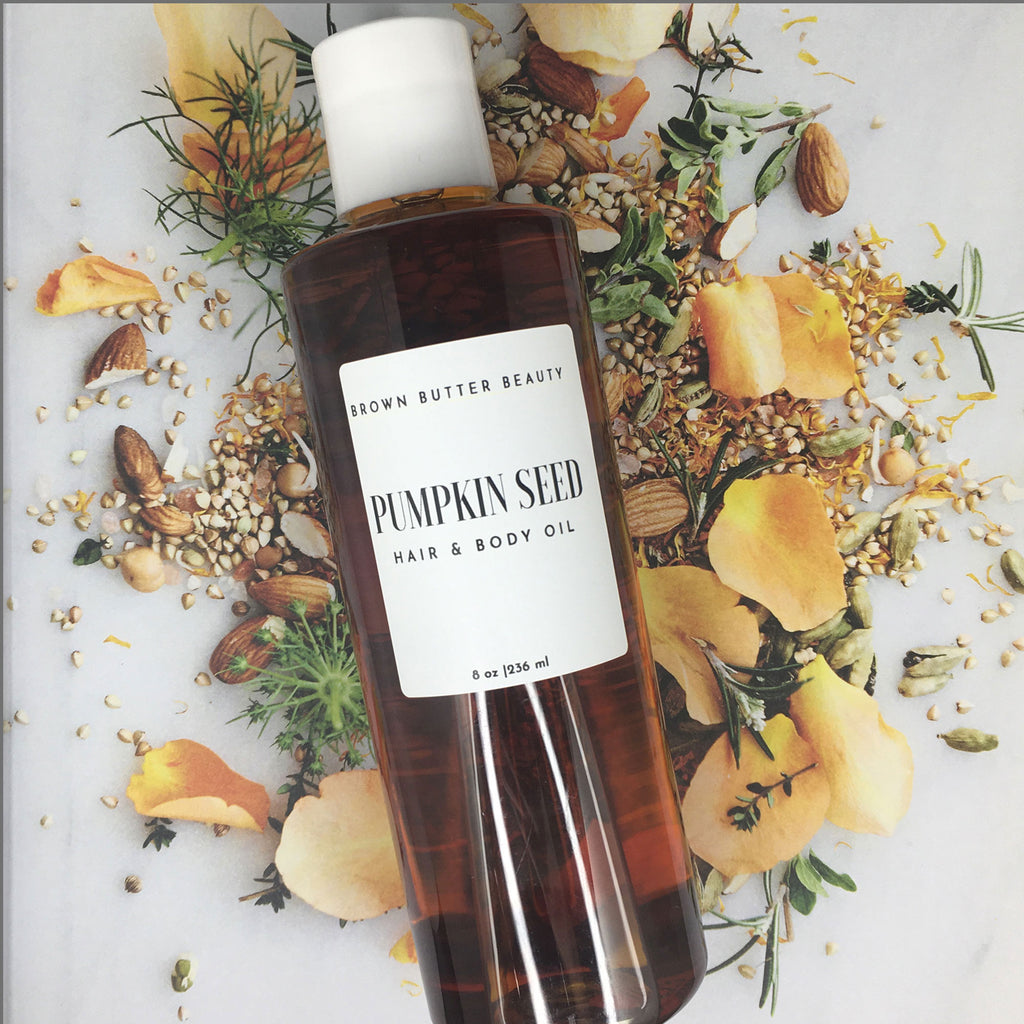 Bottle of pumpkin hair and body oil, showcasing its golden, nutrient-rich oil perfect for nourishing skin and hair. This natural pumpkin oil blend offers deep hydration and enhances skin’s glow, ideal for a moisturizing routine with botanical, antioxidant-rich ingredients